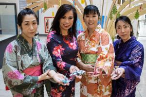 Women with paper cranes | NICRC