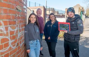 Pictured demonstrating the new app is Paul Smyth from Belfast Interface Project (back left) alongside Caitriona O'Neill, Eimear Kelly and Kevin Barry Brown from the Star Neighbourhood Centre.