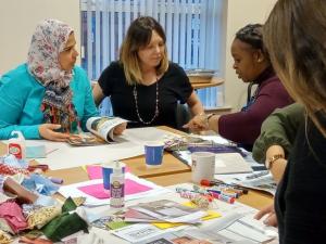 People working together around a table | NICRC