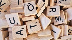 scrabble letters jumbled in a pile | CRC NI