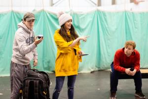 Three young actors on stage | NICRC