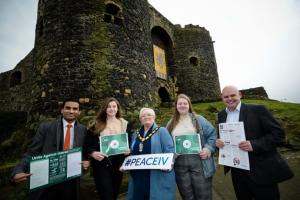 Several people outside a castle | NI CRC