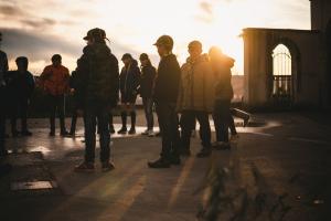 Children standing in a circle on a bridge | CRC NI