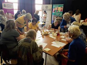 People learning together at a table | CRC NI