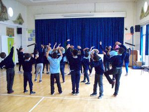 Primary school children performing a play | NICRC