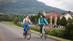 Two women on bikes | NICRC
