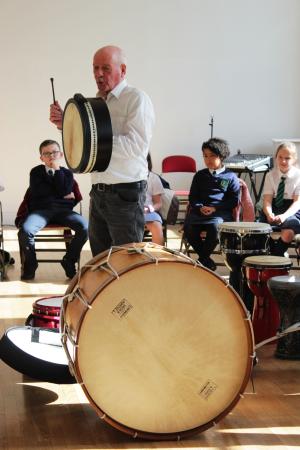Musicians playing together with school children | CRC NI