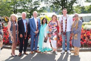 Martin McDonald, Chair of the Community Relations Council, with other people at the Mela | CRC NI