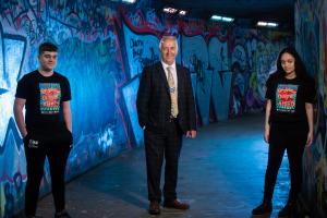 Pictured launching Good Relations Week 2021 is Martin McDonald MBE, Chair of the Community Relations Council (centre) and local young people Aaron Smith (left) and Esraa Hamido (right) | NICRC