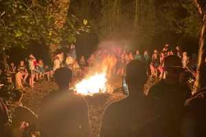 Young people around a camp fire | NICRC