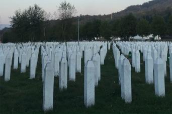 Memorial white crosses for the dead at Srebrenica | NICRC